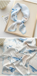 Detail of silk square scarf featuring light blue ink whale patterns and silky luster