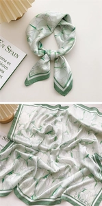 Detail of mint green floral silk square scarf with tulip print and striped edges