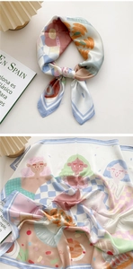 Detail of artistic cartoon illustration print and soft macaron colors on 70cm silk scarf