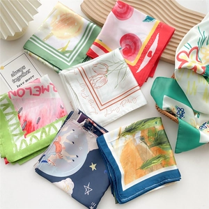 Assorted 70cm square silk scarves with floral and fruit prints on a white background
