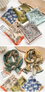 Detail of elegant long floral silk scarves in various patterns for stylish women