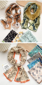 Detailed close-up of colorful floral and geometric patterns on thin silk chiffon scarves
