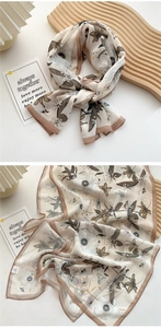 Detail view of lightweight floral silk scarf with beige base and brown abstract pattern