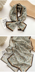 Close-up of vintage paisley pattern on lightweight long scarf with French elegant style