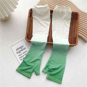 Detail of green gradient cooling arm sleeves with fingerless design and elastic cuffs