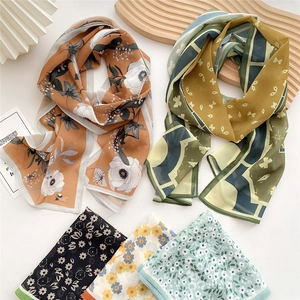 Long printed silk scarves in multiple patterns like floral and geometric designs