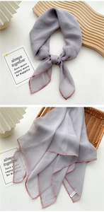 Detail of gray-purple silk scarf with pink hem draped elegantly over a woven basket
