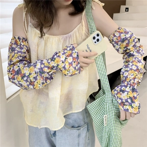 Detail of floral purple sun protection sleeves with elastic cuff and quick-dry fabric