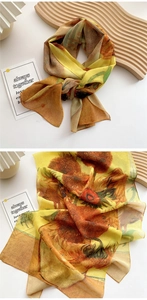 Detail of sunflower print scarf showing the artistic pattern and knotted silk texture