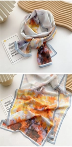 Detail of artistic oil painting print long scarf with light blue stitched edge