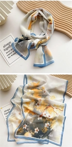 Detailed view of floral long scarf showing vibrant yellow flowers and sky blue edges