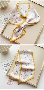 Dettaglio di twilly in seta a fiori rosa con bordo giallo su decorazione elegante