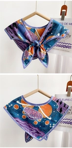 Detail of satin space planet print neck scarf with adjustable bow tie ribbon