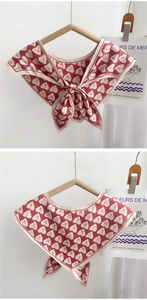 Detail of satin silk triangle scarf with red heart LOVE print and elegant neck tie design