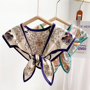 Elegant vintage horse carriage print silk scarves displayed on wooden hangers for styling