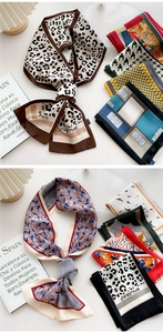 Detailed view of printed silk scarves featuring leopard, polka dots and art patterns