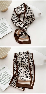 Detail of leopard print narrow twilly silk scarf with sleek diagonal cut ends