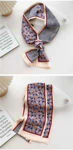 Detail of double-sided silk neck scarf with floral patterns and red piping trim