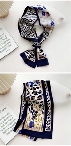 Detail of skinny silk scarf with blue floral and leopard print patterns and textures