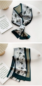 Detail of floral silk scarf with hand-lettered text and dual-color block stitching