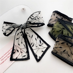French style skinny silk scarf with black floral mesh design and bow tie detail
