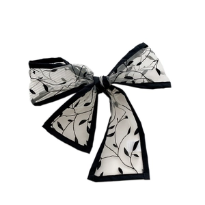 Elegant white tulle hair bow with black floral embroidery and long ribbons for women