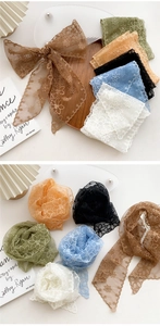 Close-up of floral lace skinny scarves in six colors with delicate embroidery details