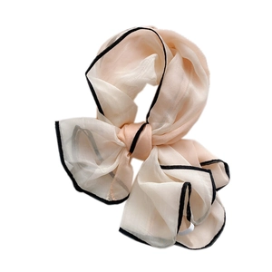 Elegant champagne silk scarf with black contrast hem in a light Korean style