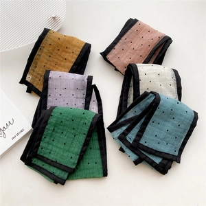 Set of six colorful polka dot skinny scarves in french style for hair and bag decoration