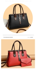 Close-up of pebble-grain leather bag with contrast handles and metallic buckle