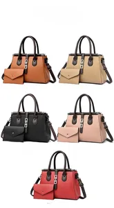 Detailed view of the 2-piece tote bag set with matching clutch in five stylish colors