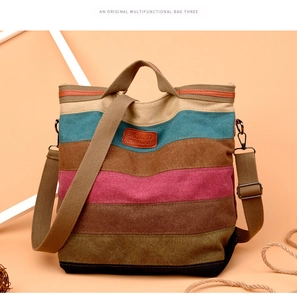 Detail view of colorful striped canvas tote bag with adjustable strap and top handles