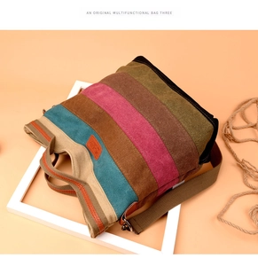 Close-up of durable striped canvas texture and orange leather brand label on tote bag