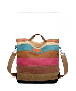 Front view of multi-color striped canvas tote bag with adjustable shoulder strap