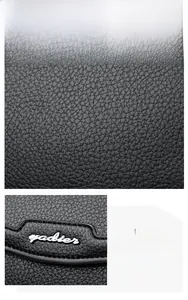 Close-up of black pebbled leather texture and silver yadier metal logo on a shoulder bag