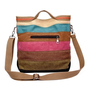 Colorful striped canvas tote bag with adjustable shoulder strap and zip pocket