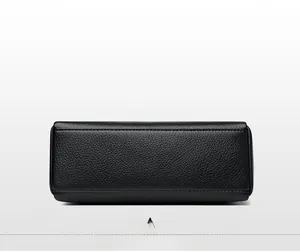 Detailed view of the black leather bag base featuring clear lychee texture and neat stitching