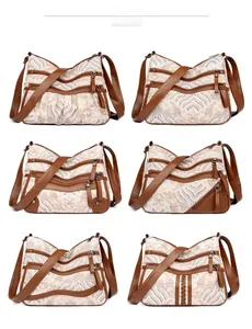 Detail view of vintage jacquard crossbody bags with multiple zipper pockets in six patterns
