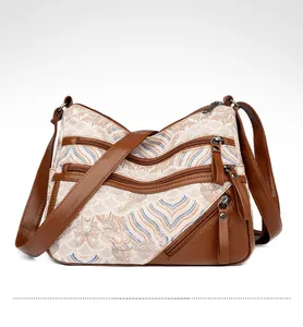 Detail of vintage tote bag with wave pattern print and multi-layered zip pockets