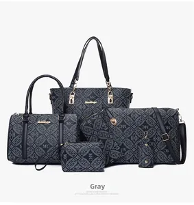 Détail du lot de 6 sacs gris avec motifs monogrammes 1989 et finitions dorées