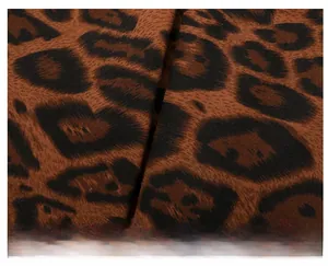 Macro shot of vintage leopard print fabric with detailed dark brown and black pattern texture