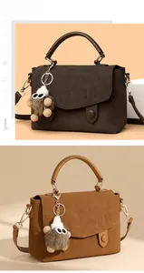Detailed view of vintage faux suede messenger bags in dark brown and caramel with plush charms
