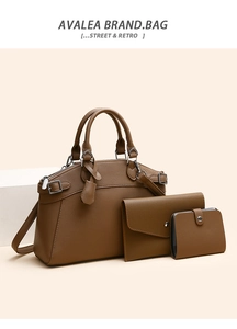 Detailed set of brown leather tote bag, clutch and card holder on a display stand