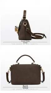 Detail view of large brown faux suede messenger bag with top handle and plush charm