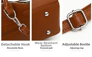 Detail view of brown pebbled leather bag with metal hooks and protective bottom studs