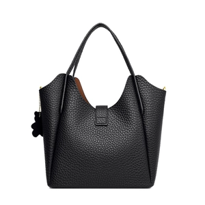 Black lychee texture bucket bag with top handles and a cute bear leather charm detail