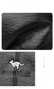 Dettaglio della pelle nera e del logo del canguro in argento sulla borsa a mano