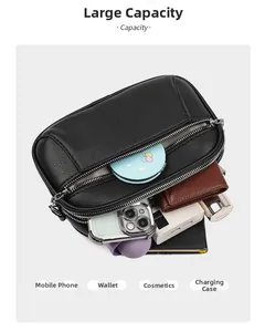 Detail view of multi-compartment black litchi leather bag with high storage capacity