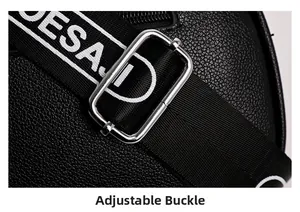 Detail of adjustable nylon strap with white letters and silver buckle on black crossbody bag