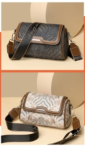 Detail view of two Boston-style barrel bags with vintage wave patterns and wide straps